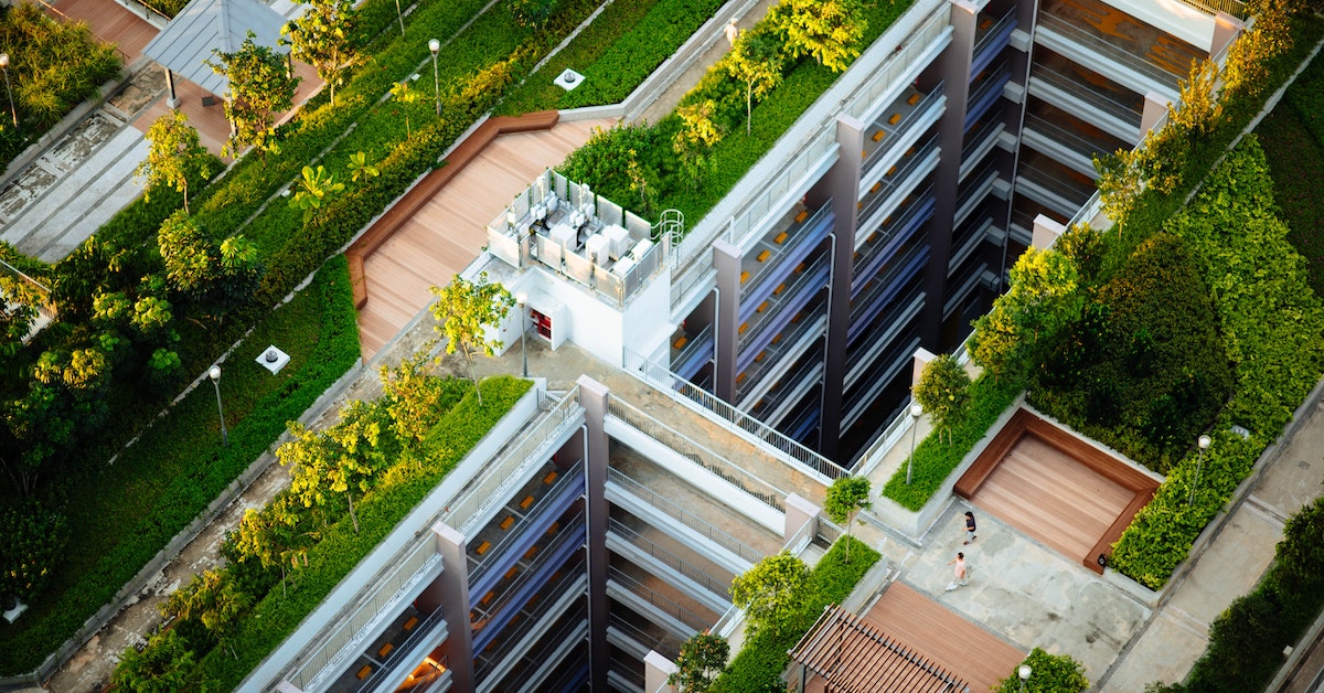 A 3D rendering of a rooftop park atop a mixed-use building.