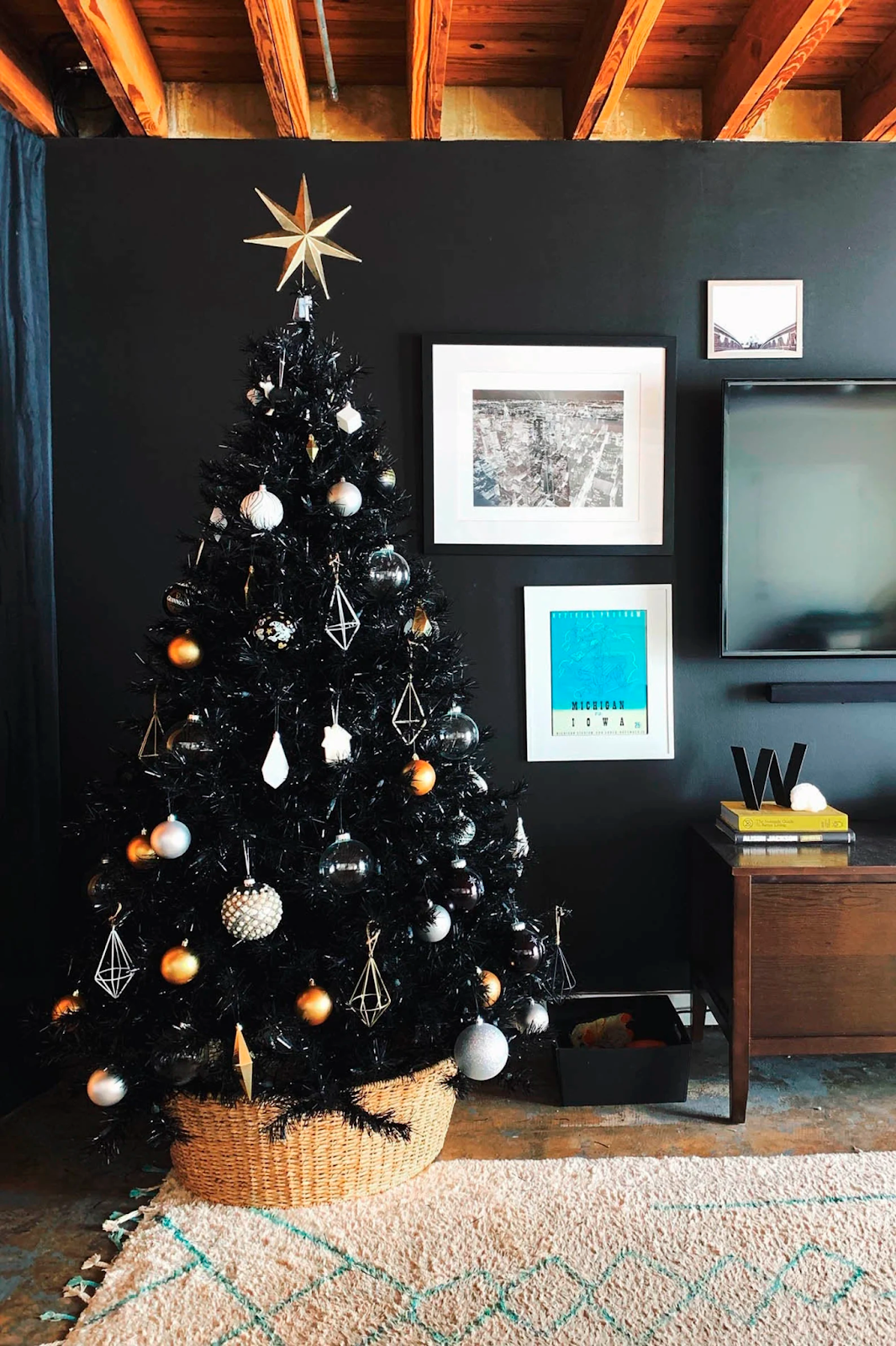Towering artificial black Christmas tree
