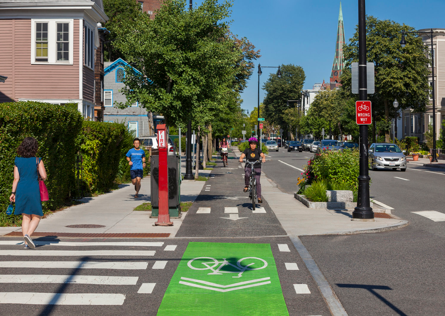 Example of a raised crosswalk with adjacent raised bike path crossing.