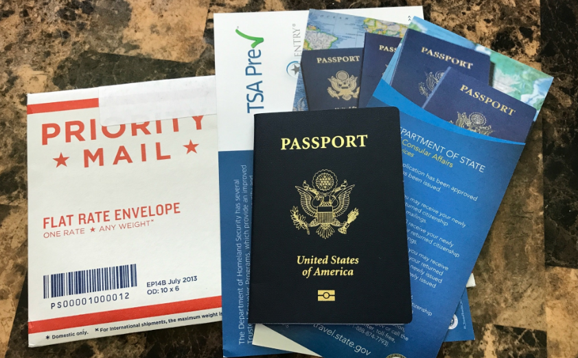 Several passport and a passport  Description automatically generated with medium confidence
