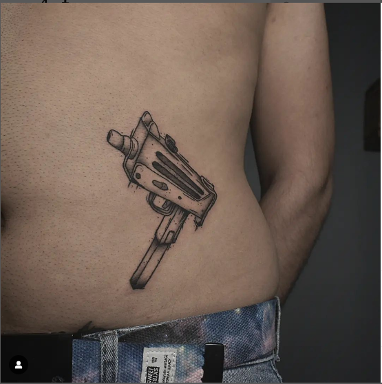 Funky Gun Tattoo On Waist
