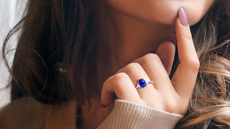 sapphire ring on woman’s hand