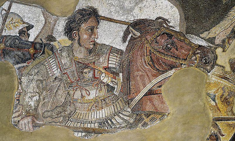 Mosaic of Alexander charging on a battlefield. He is not wearing a helmet and is riding a horse.