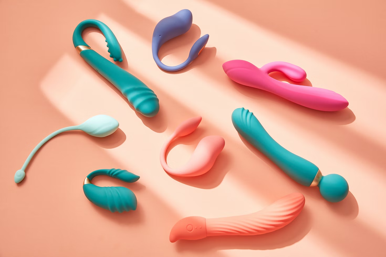 Image displaying a variety of eight vibrators in diverse colors, shapes, and sizes.