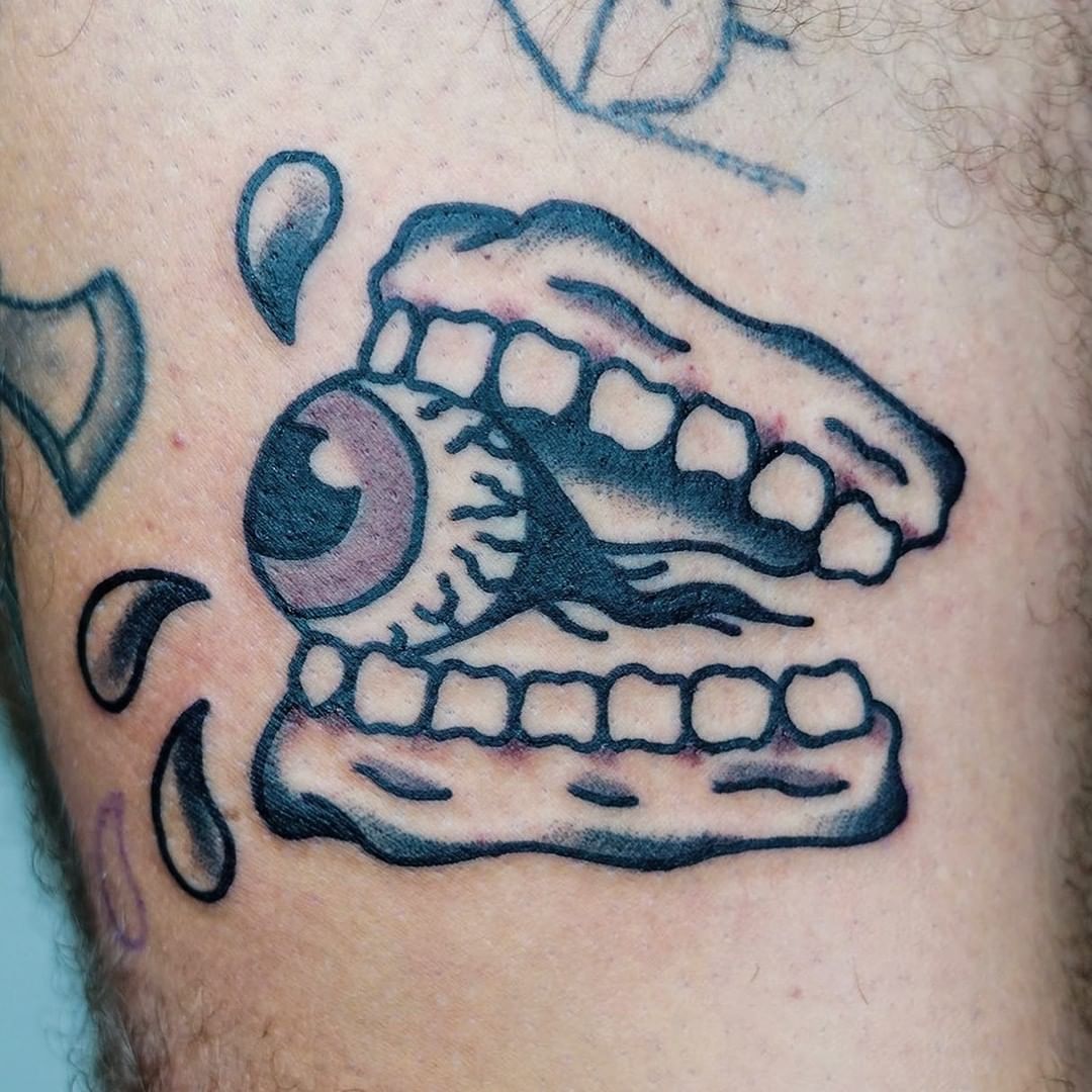 Eye In Teeth Tattoo