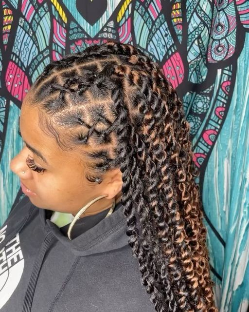 Side view of a lady rocking the criss crossed coiffure 