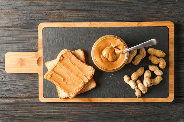 A tray with peanut butter featuring slices of bread. Peanut Nutrition Facts