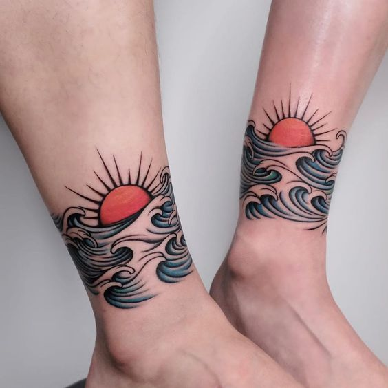 Picture showing the sun and wave tattoo on an ankle