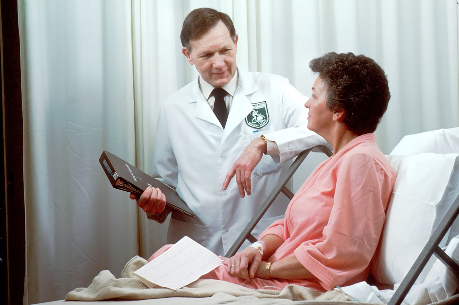Doctor talking to his patient at the hospital