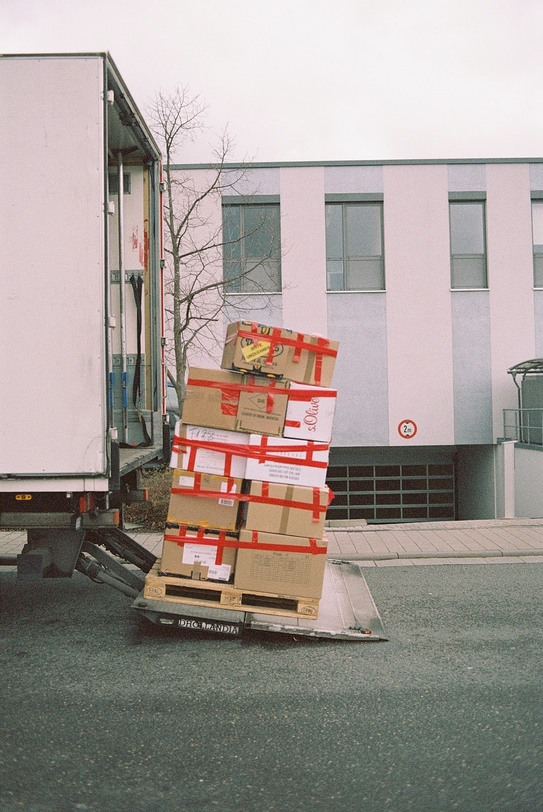 Cargo Transport Tips; stacks of boxes taped together and placed near a vehicle
