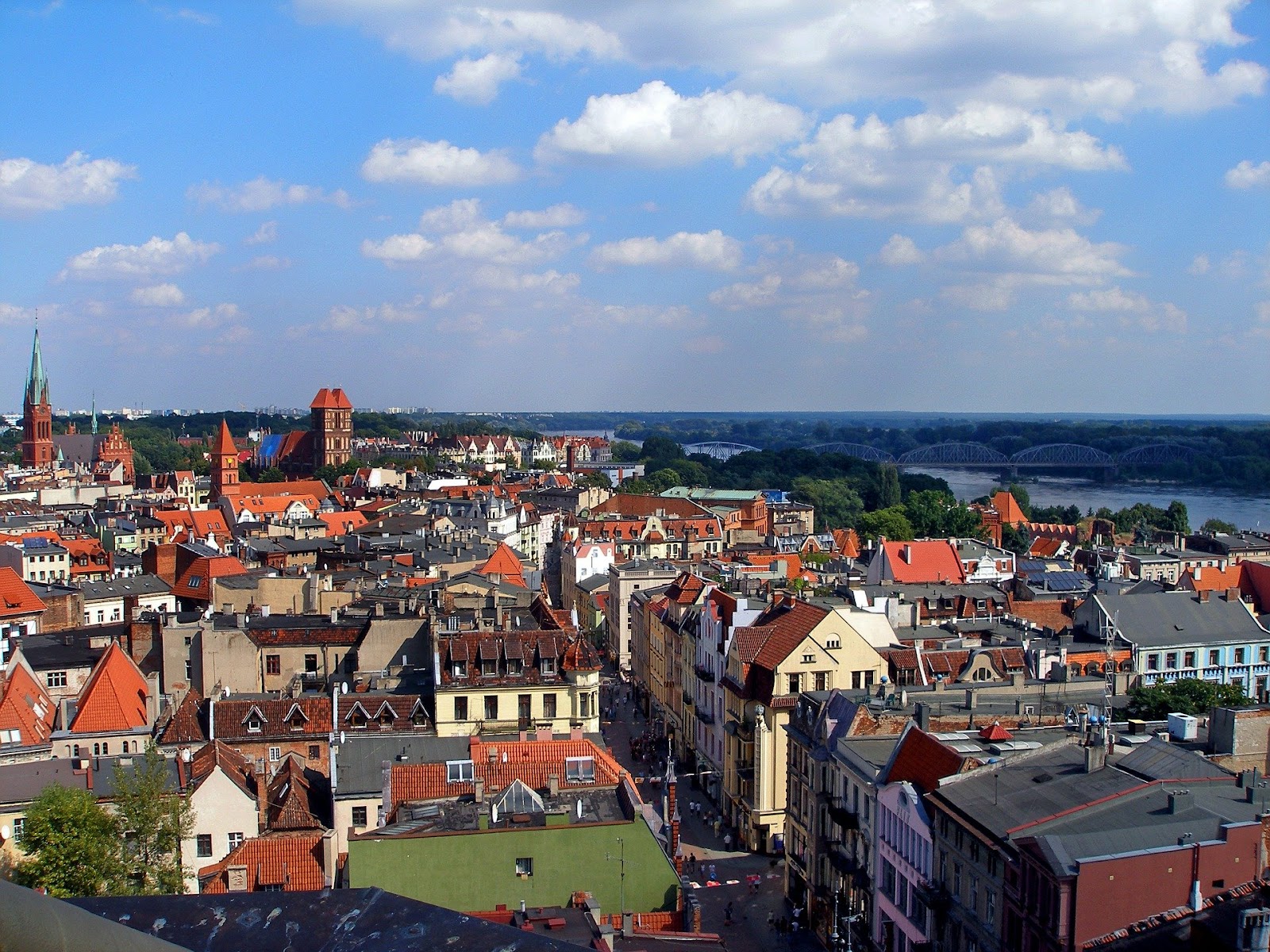 torun old town colorful medieval buildings on a sunny day vistula river in background