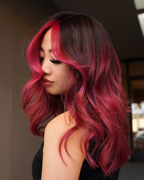 a lady  rocking the  red and black hair