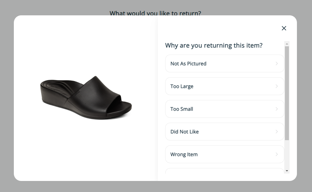 A black slipper with white text

Description automatically generated