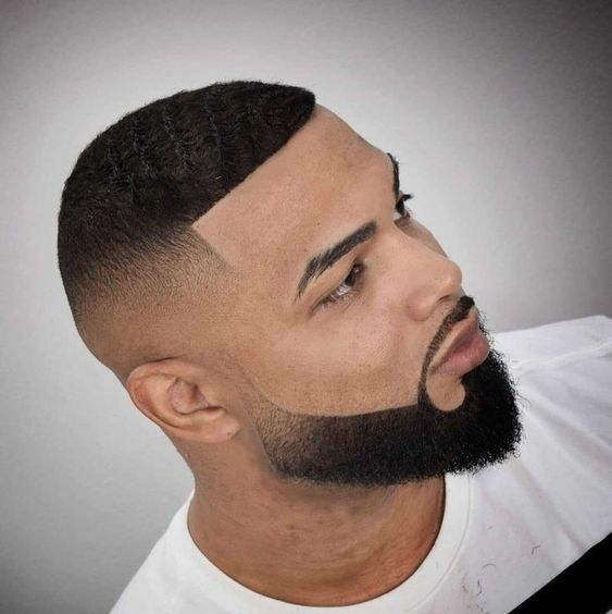 fine man with a fade cut and a beard