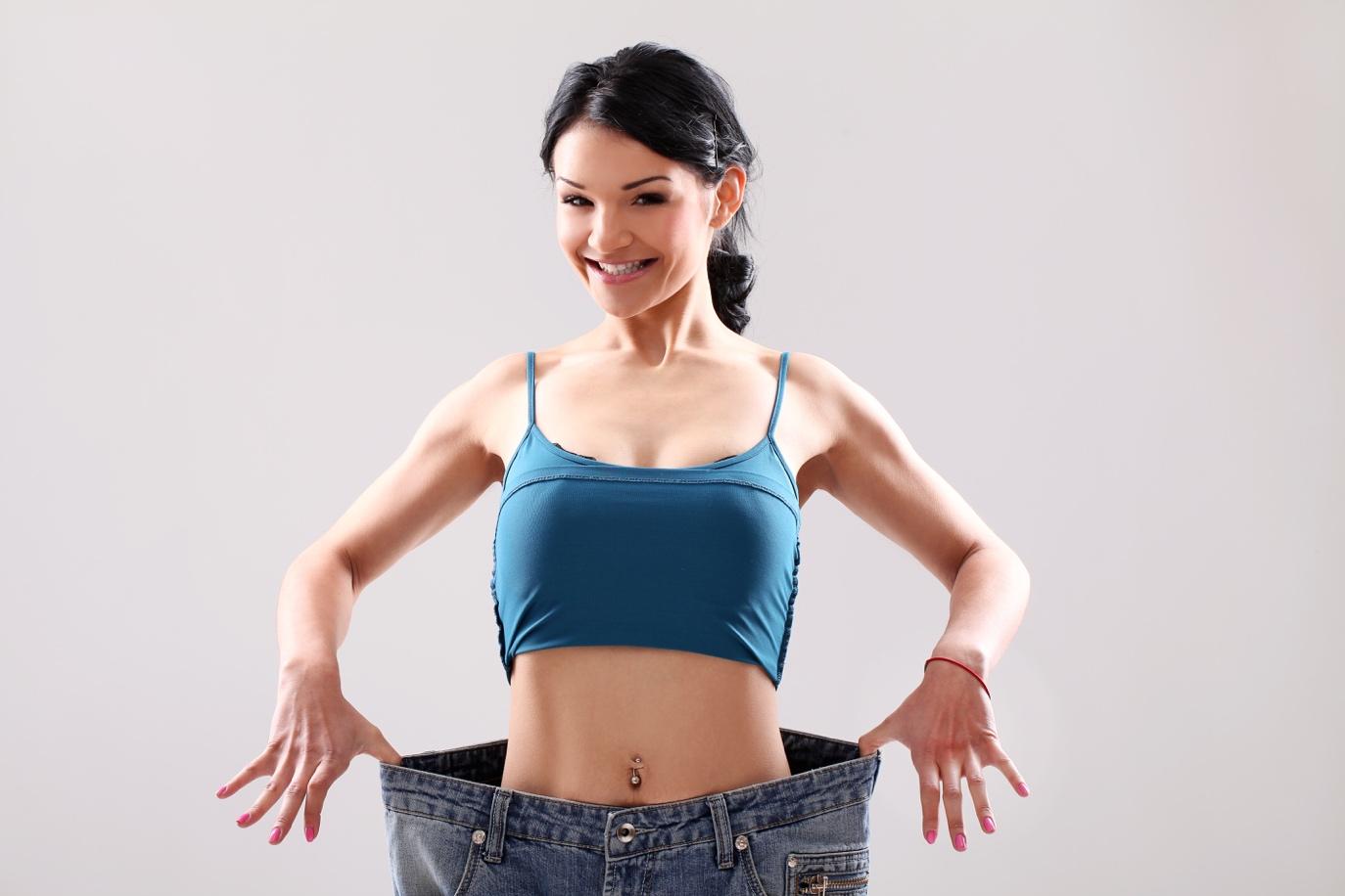 ../../Downloads/portrait-woman-showing-her-weight-loss.jpg