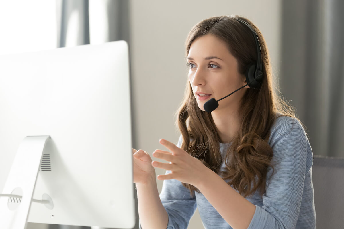 Patient portal: psychologist wearing headphones and using a computer