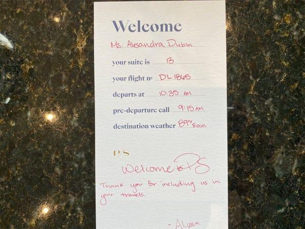 Private Suite Review - A hand-written card in our suite established the timeline for our flight prep, and offered a personal touch.