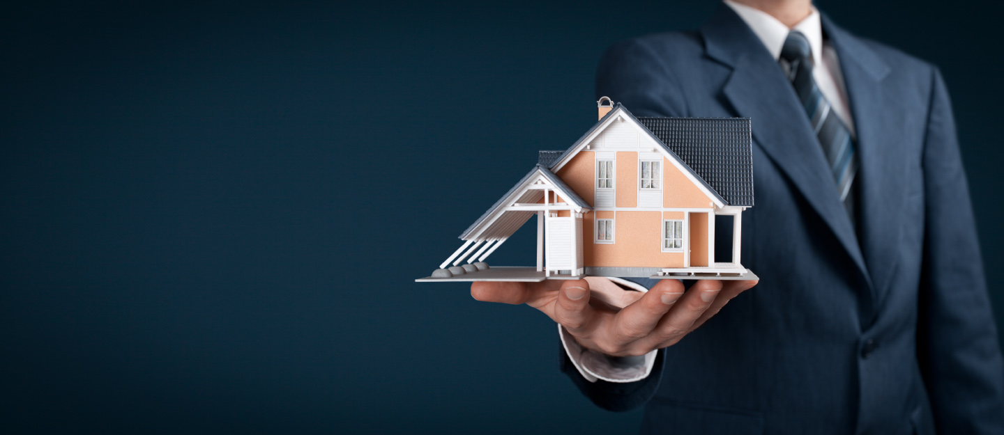 Man holding house best work for Taurus