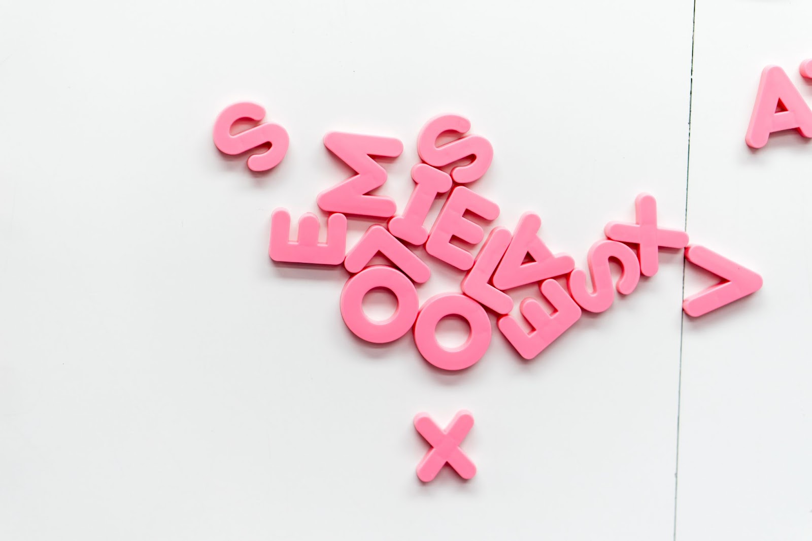 seo for etsy - a jumbled up pile of pink letters