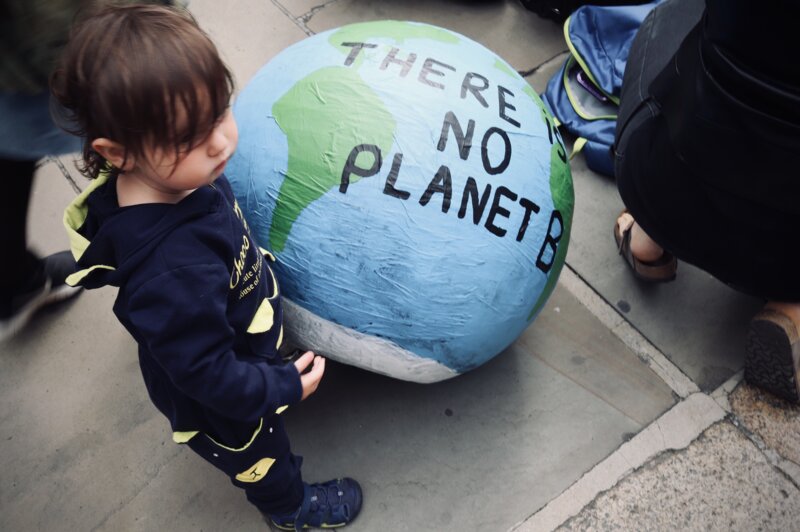 A child with an Earth globe