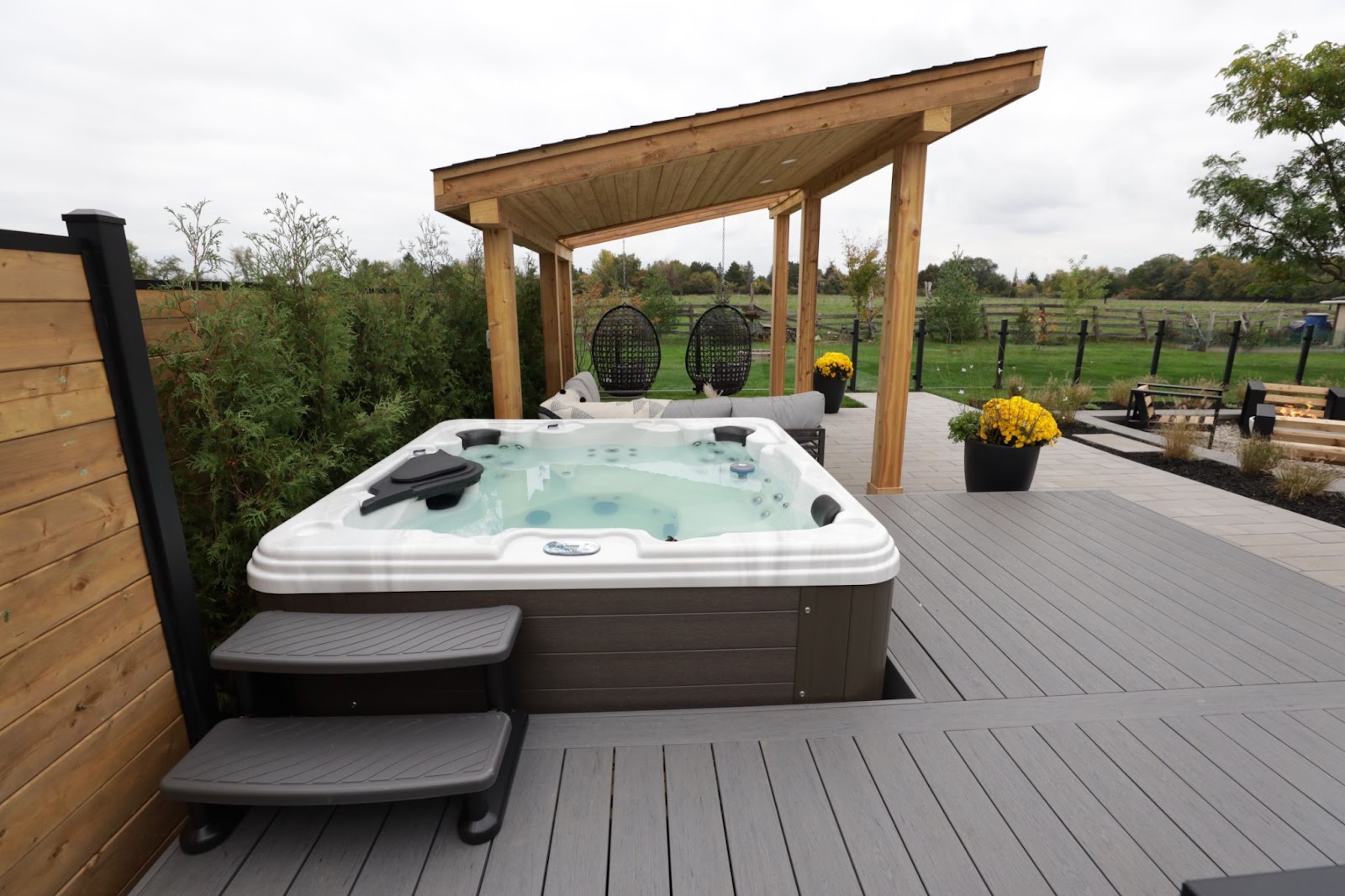 Image of Outdoor Backyard from Mike Holmes latest show Holmes Family Rescue, featuring Leisure Pools Hot Tub.