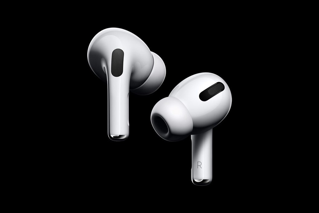 This image shows the Apple AirPods 3rd Generation on black background.