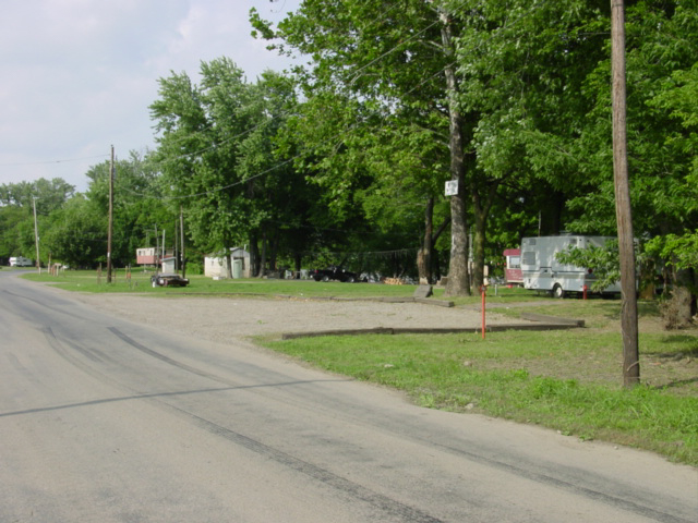 Trailers are visible from the road where people live along the Mt. Carmel riverfront. 