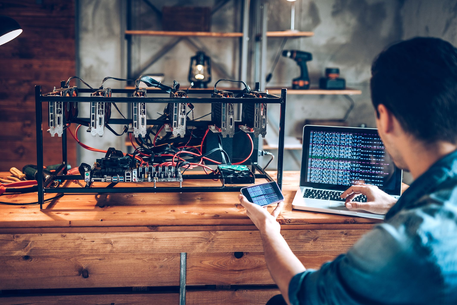 Person setting up Bitcoin mining gear such as an ASIC rig.