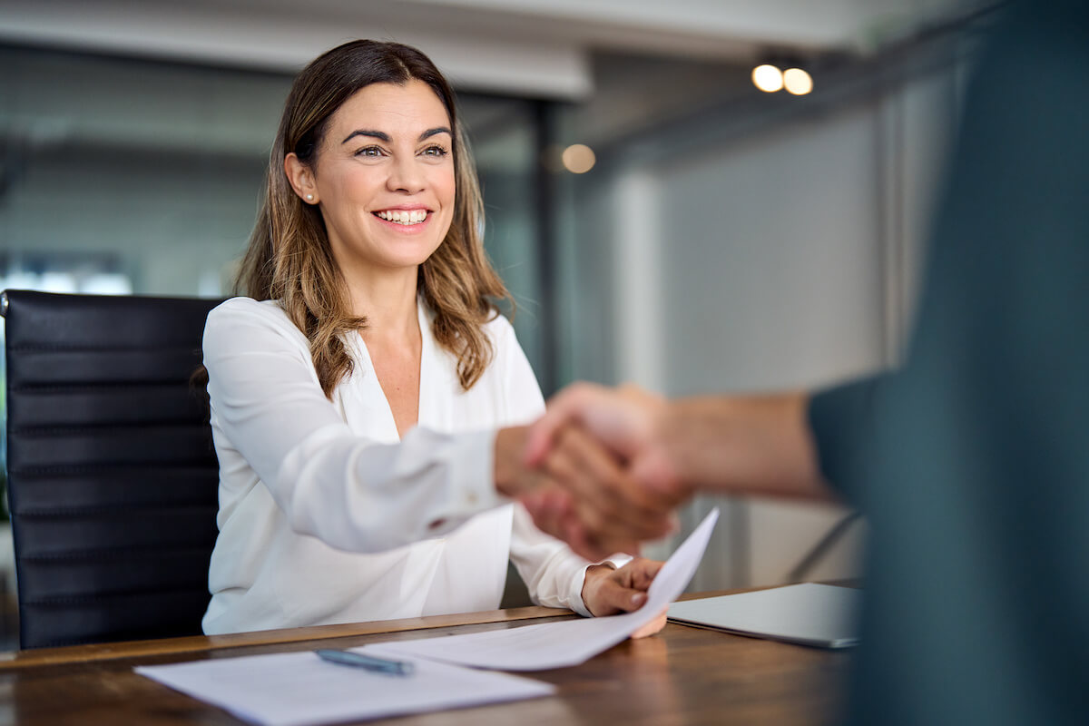 Workforce analytics software: colleagues shaking hands with each other