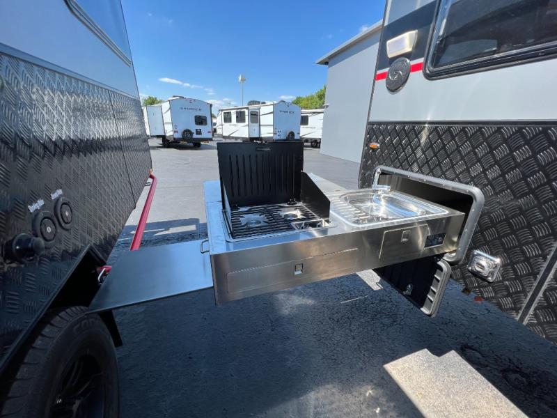 This pull-out stainless steel kitchen is perfect for cooking at the campground.