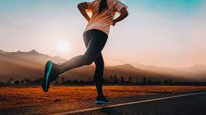 Woman running on tarred road