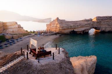 A picture containing sky, water, outdoor, rock

Description automatically generated
