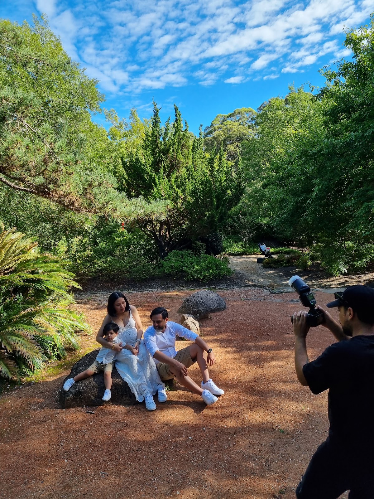 Maternity photoshoot for a lady in white dress with her family at Fagon Park Galston - Chinese garden sections. 