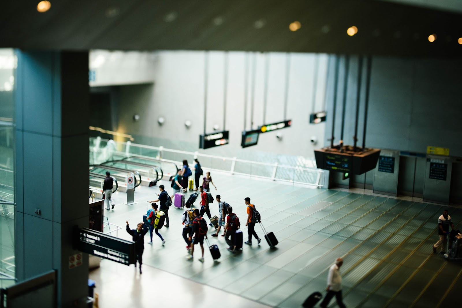 People coming in and out of an airport