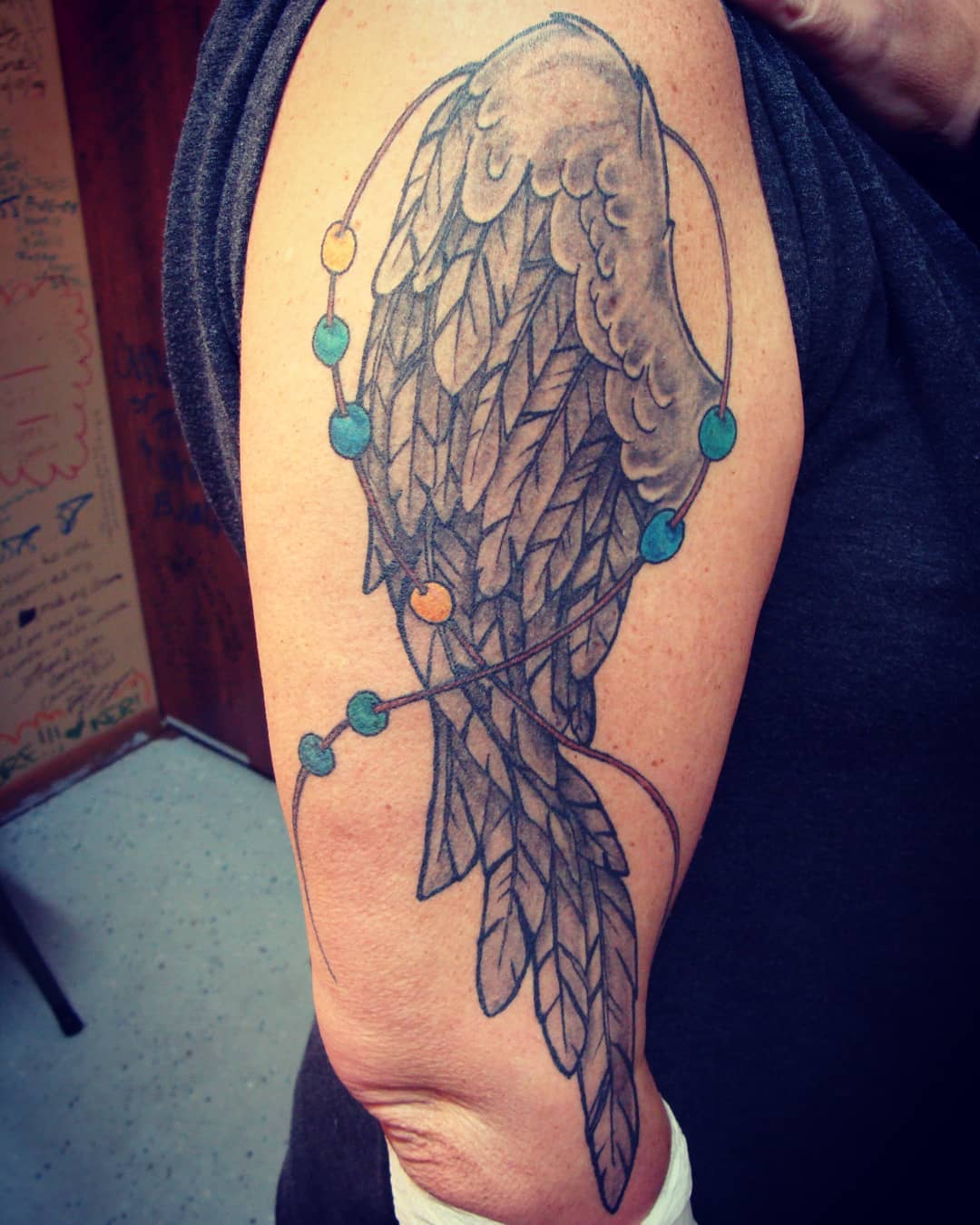 Colored Wings With Beads Tattoo