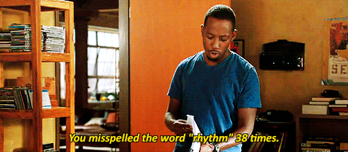 Winston from New Girl, flipping through a manuscript saying, "You misspelled the word 'rhythm' 38 times."