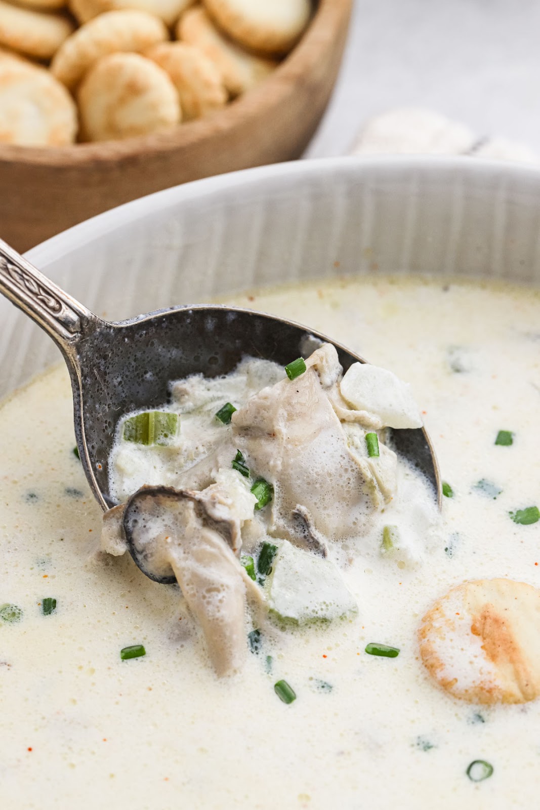A close up of oyster stew being served
