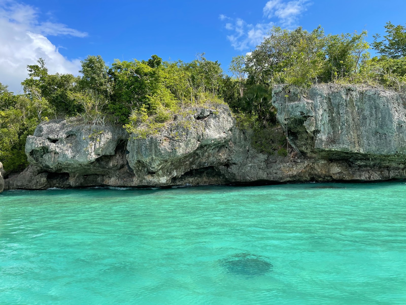 A stunning view of Bahia de las Aguilas, showcasing the pristine turquoise waters and unique rock formations.