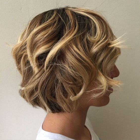 beautiful blonde curly short layering hair