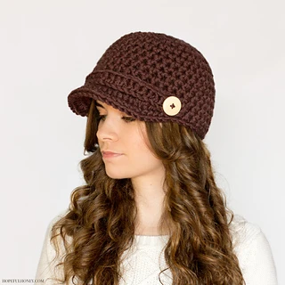 woman wearing brown newsboy hat with buttons