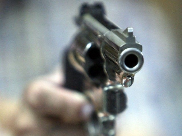 An employee at John Jovino Co. holds a revolver on Thursday, June 26, 2008 in New York. The U.S. Supreme Court ruled earlier in the day that Americans have a constitutional right to keep guns in their homes for self-defense - the justices' first major pronouncement on gun control in U.S. history.