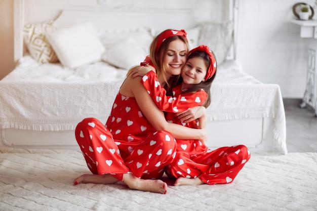 Cute mother and daughter at home in a pajamas Free Photo