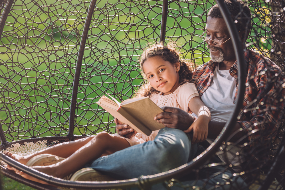 Young Girl learning phonograms from her dad