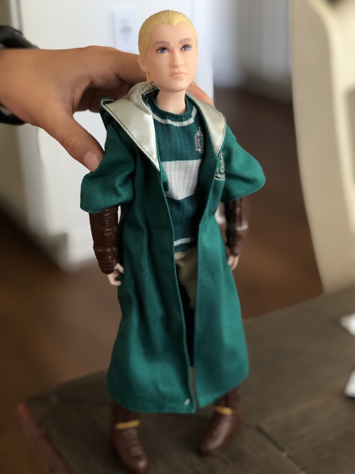 A Harry Potter action figure on a table.