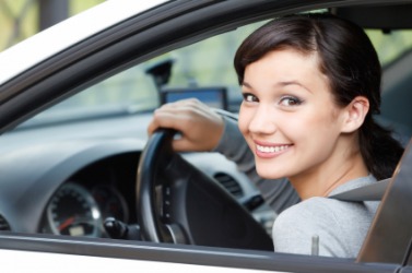 A young woman behind the wheel.