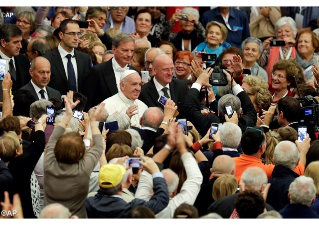 Pope Francis arrives to meet an association of elderly workers during a special audience he granted them in the Pope Paul VI hall, at the Vatican, Saturday, Oct. 15, 2016 - AP