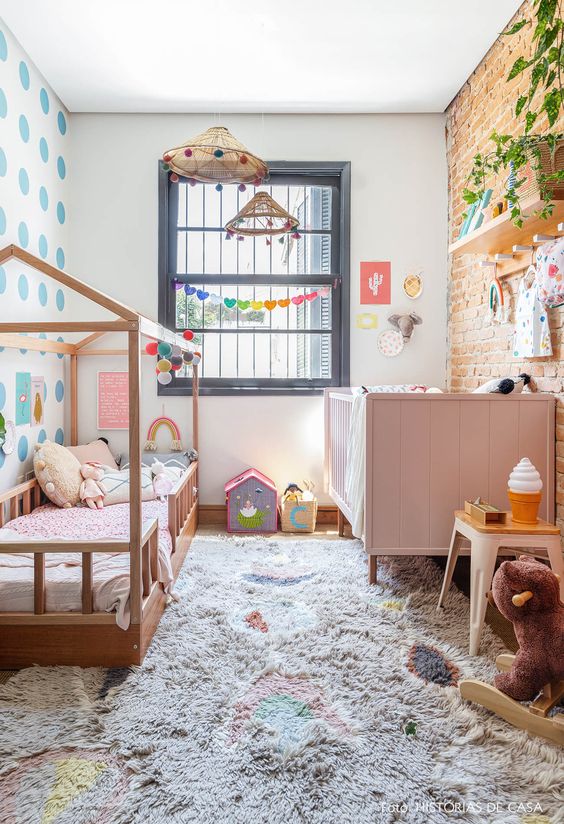 Colourful toddler and baby shared room