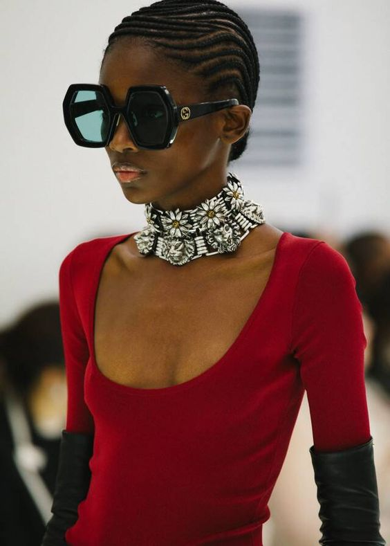 a model wearing sunshades with cornrows for styling natural short hair