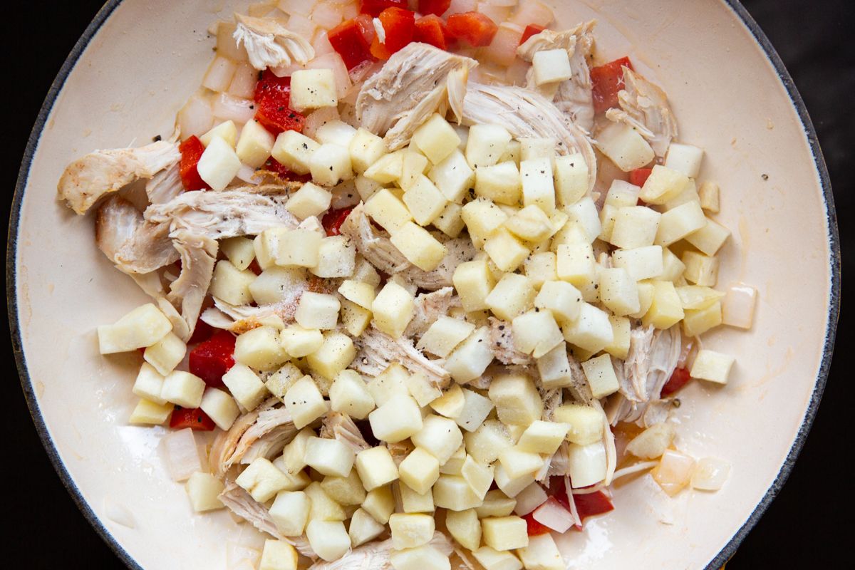 turkey and hashbrown added on nonstick pan