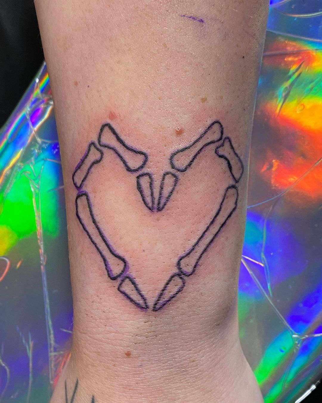 Heart Shaped Bone Tattoo